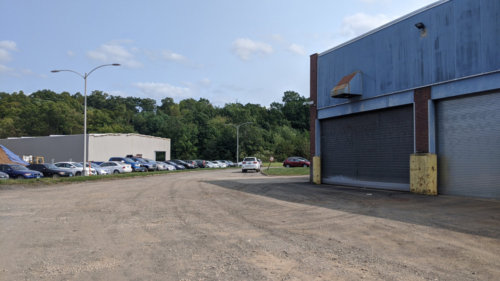 Side Loading and Front Parking area. New building in development in background